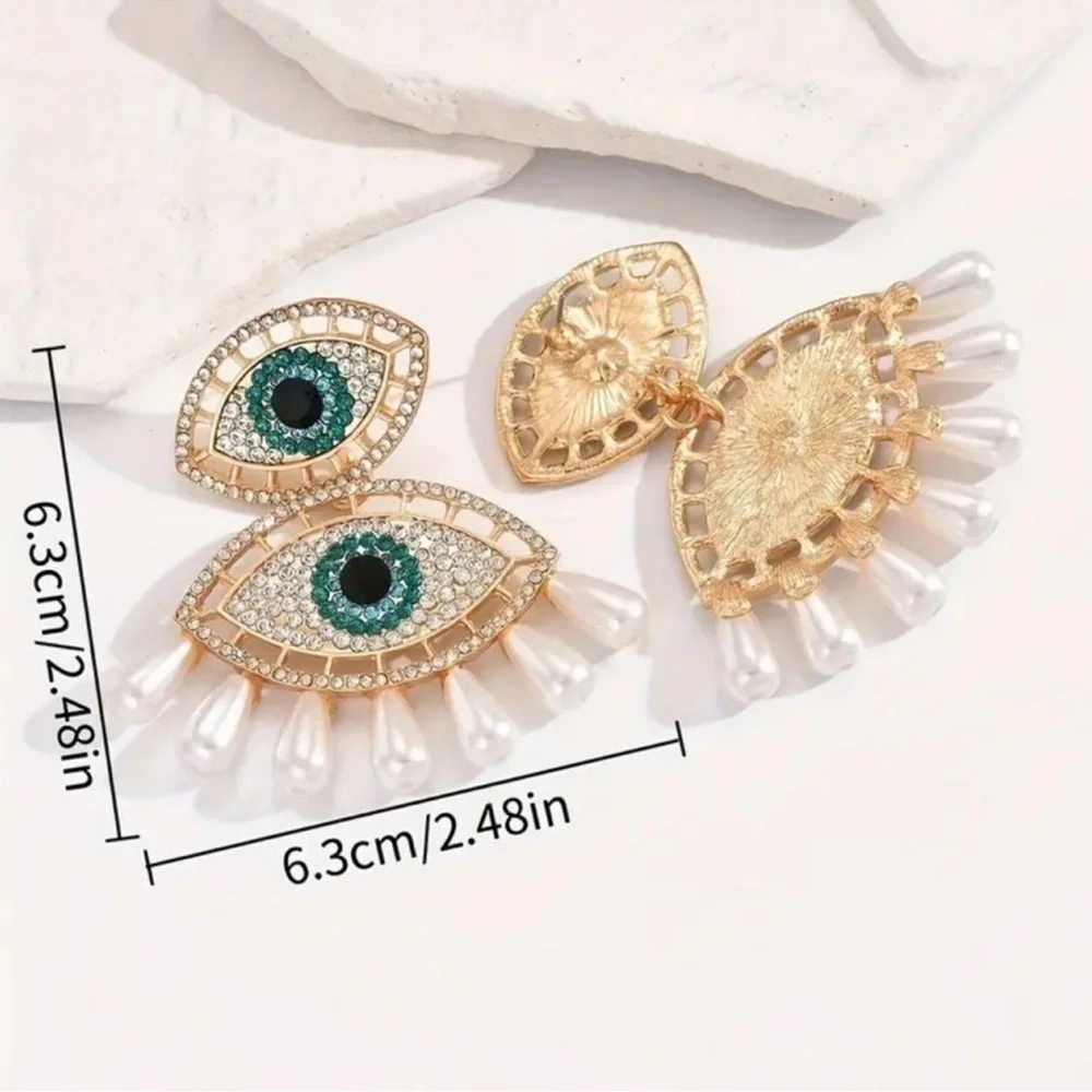 Elegant Gold and Pearl Eye Earrings